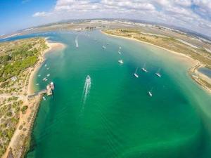 an aerial view of a bay with boats in the water at A casa da Maria in Luz de Tavira