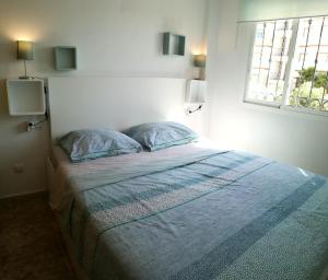 Postel nebo postele na pokoji v ubytování Casa Punta Prima