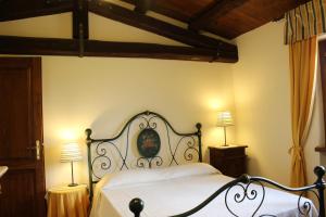 Posteľ alebo postele v izbe v ubytovaní Villa di Castello