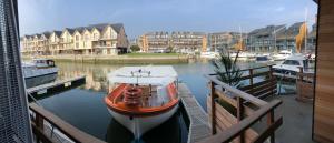 a boat is docked at a dock in a harbor at MARINA 177 DEAUVILLE in Deauville