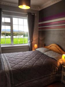 Postel nebo postele na pokoji v ubytování Naomh Colman B&B