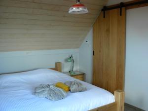 Postel nebo postele na pokoji v ubytování B&B De Hostelier