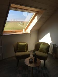 Posezení v ubytování B&B De Hostelier