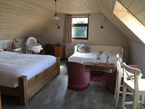 Postel nebo postele na pokoji v ubytování B&B De Hostelier