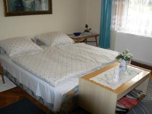 Cama ou camas em um quarto em Móricz Ház