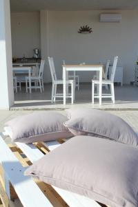 two pillows sitting on a table in a room at Piccolo Ulivo B&B Salento in Vernole