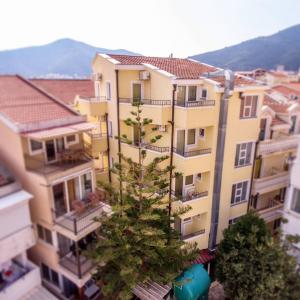 a christmas tree in the middle of a building at Venera Apartments in Budva