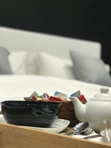 Łóżko lub łóżka w pokoju w obiekcie Parthenope Rooms