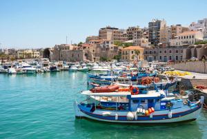 a group of boats are docked in a harbor at Orange Central Studio Heraklion in Heraklio