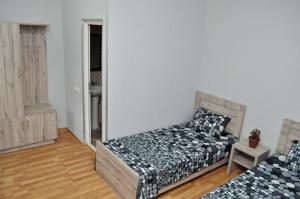 מיטה או מיטות בחדר ב-Sofia Guest House