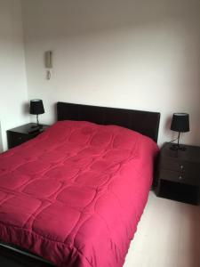 Voodi või voodid majutusasutuse Suites Parque Real toas