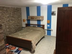 Łóżko lub łóżka w pokoju w obiekcie Monolocale per Vacanze