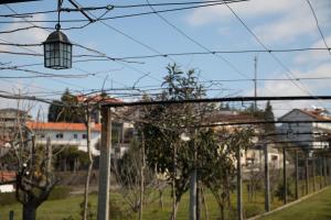 a bunch of wires with trees and houses at Hotel Solar das Laranjeiras in Vale de Cambra