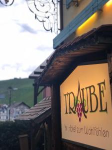 a sign for a winery with a sign for a building at Landhotel Traube in Baden-Baden