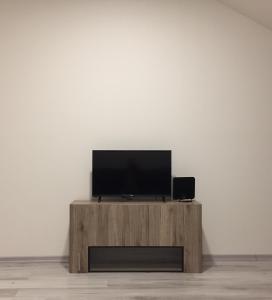 TV a/nebo společenská místnost v ubytování Apartmány Jarkova