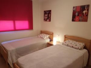 A bed or beds in a room at Como En Casa
