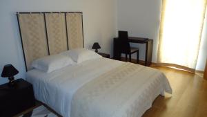 Uma cama ou camas num quarto em Casa da Ladeira, Turismo Rural