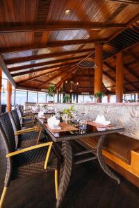 a dining room with a long table and chairs at Grandvrio Resort Saipan in Garapan