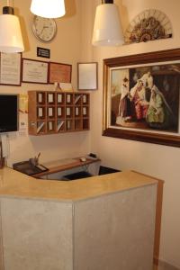 a room with a picture of people on the wall at Hostal Santa Cruz in Madrid