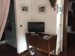 a television sitting on a table in a room at Relax holiday in Sestriere