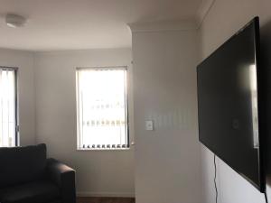 TV a/nebo společenská místnost v ubytování Uni Motel