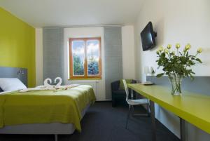 Posteľ alebo postele v izbe v ubytovaní Hotel Herrmes