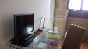 Televízia a/alebo spoločenská miestnosť v ubytovaní La Capellanía