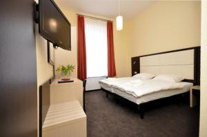Postel nebo postele na pokoji v ubytování Hotel Bova