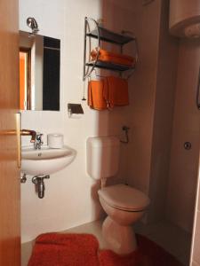 a bathroom with a toilet and a sink at Blue Bench Krk in Krk