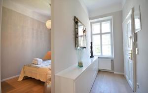 A bed or beds in a room at Vienna Residence | Modern, bright business apartment in Vienna city center, Alsergrund