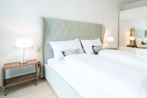 Łóżko lub łóżka w pokoju w obiekcie Vienna Residence | Spacious Serviced Apartment in Vienna directly at the U4