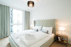 Łóżko lub łóżka w pokoju w obiekcie Vienna Residence | Spacious Serviced Apartment in Vienna directly at the U4