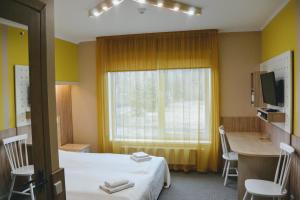 Postel nebo postele na pokoji v ubytování Alba Hotel