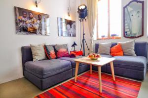 a living room with a couch and a table at Pawlansky Apartments in Prague