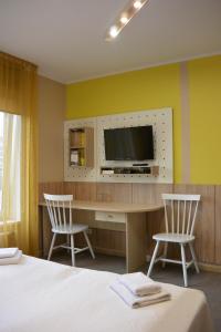 TV a/nebo společenská místnost v ubytování Alba Hotel