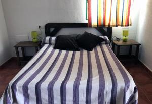 Gulta vai gultas numurā naktsmītnē Acogedor apartamento en San Miguel de Abona