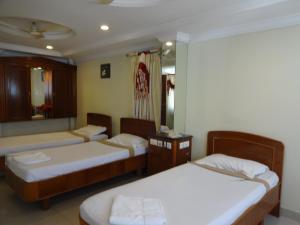 Postel nebo postele na pokoji v ubytování Hotel Susee Park