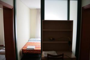 A bed or beds in a room at Melusina Bocca di Piazza Venice Historical Center