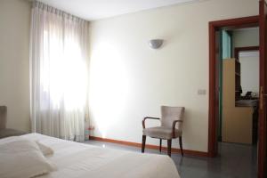 A bed or beds in a room at Melusina Bocca di Piazza Venice Historical Center