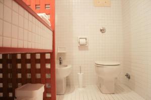 a bathroom with a toilet and a sink at Bocca di Piazza in Venice