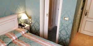 Postel nebo postele na pokoji v ubytování Hotel Villa Delle Palme