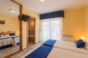 Posteľ alebo postele v izbe v ubytovaní Hotel La Bolera