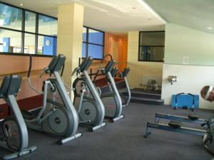 a gym with several treadmills and exercise bikes at Whoop Hall Hotel and Leisure in Kirkby Lonsdale