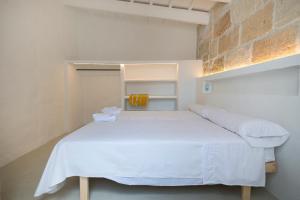 A bed or beds in a room at qui no passa