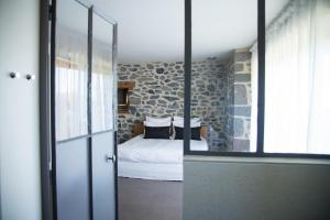 Postel nebo postele na pokoji v ubytování Aux Caprices d'Aubrac