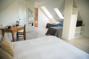 Postel nebo postele na pokoji v ubytování Aux Caprices d'Aubrac