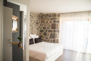 Postel nebo postele na pokoji v ubytování Aux Caprices d'Aubrac