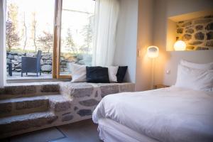 Postel nebo postele na pokoji v ubytování Aux Caprices d'Aubrac