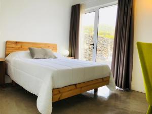 Postel nebo postele na pokoji v ubytování Casa da Rocha