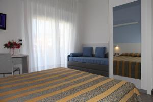 Postel nebo postele na pokoji v ubytování Hotel Pillon